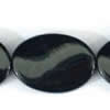 Gemstone beads, black stone, twist oval, 30x20mm, Sold per 16-inch Strand